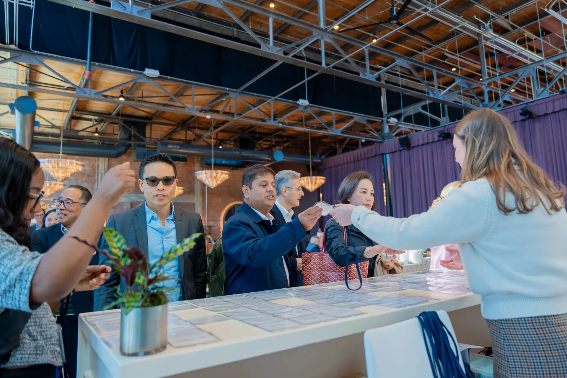 Attendees checking in at registration table during corporate event at The Revelry North End Charlotte