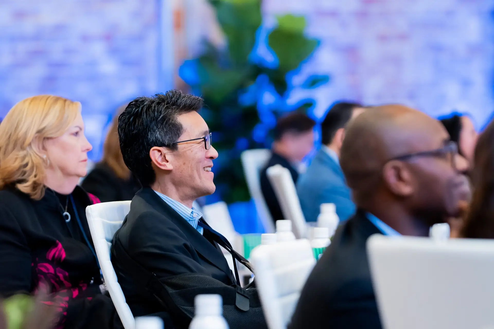 Audience reaction and applause during corporate keynote address in Charlotte