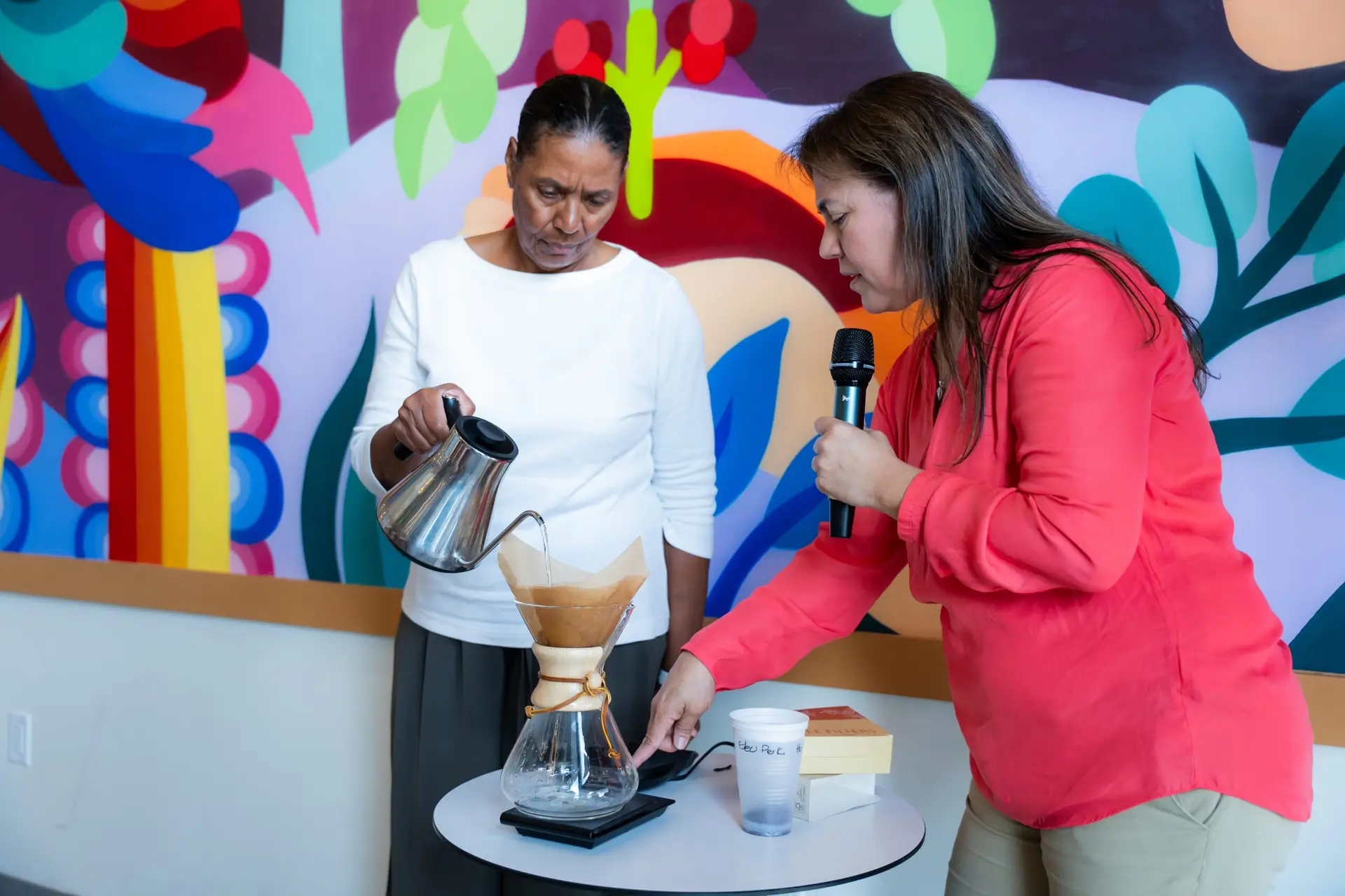 Executives learning French press coffee brewing techniques - Wynwood Event Photographer