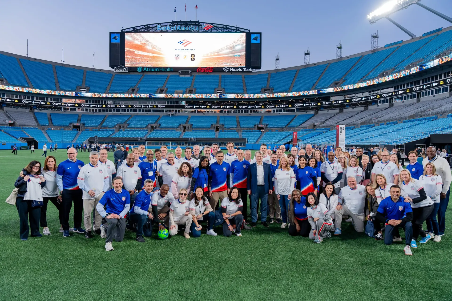 Group photo on the soccer pitch at Atrium Health Performance Park during evening activation