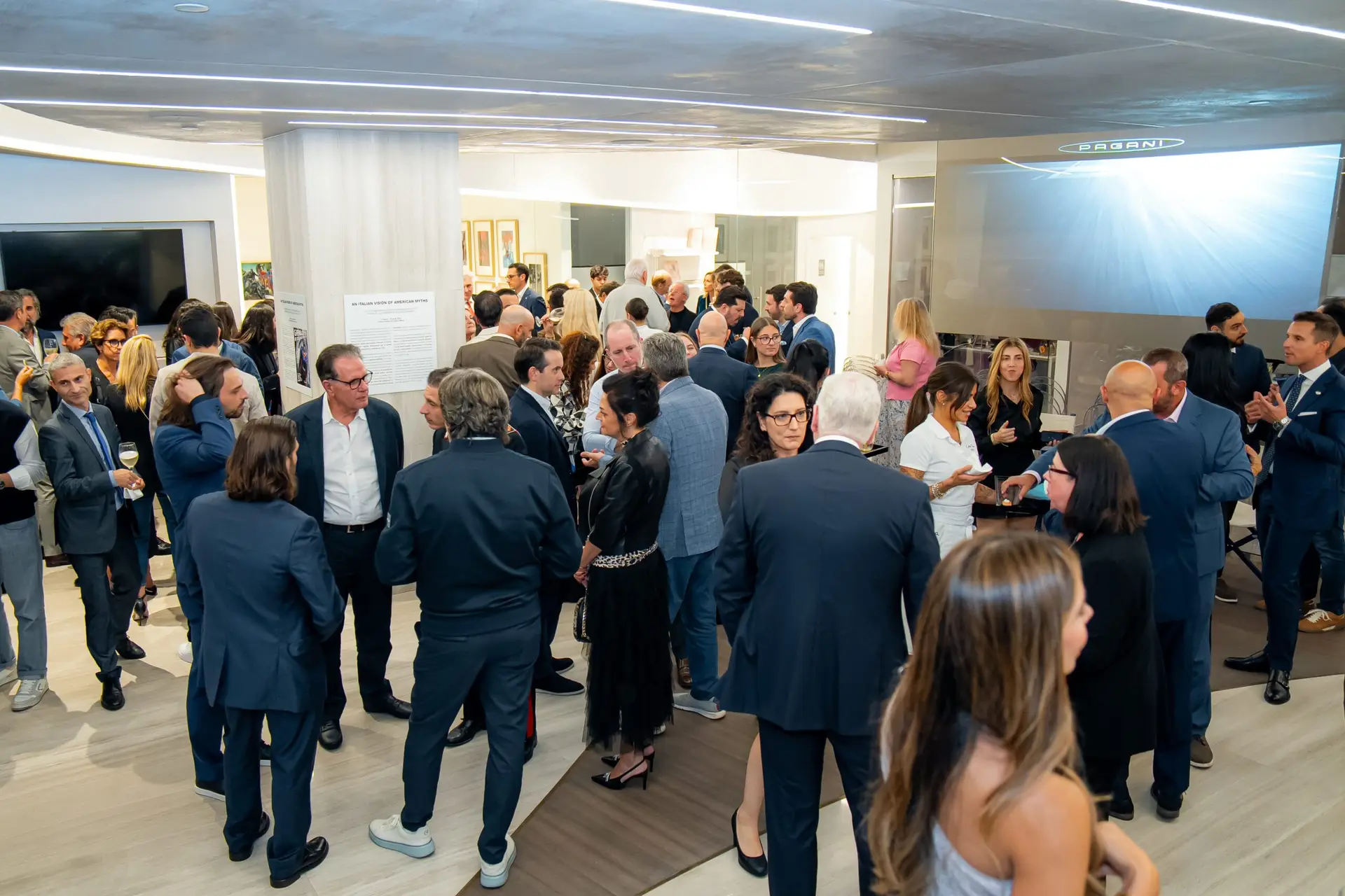Guests experiencing a Pagani Automobili vehicle showcase during an exclusive Miami brand event