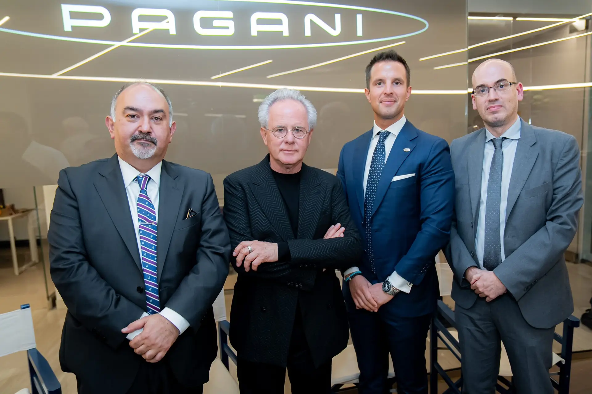 Professional corporate photographer capturing executive portraits and guest interactions at the Pagani event
