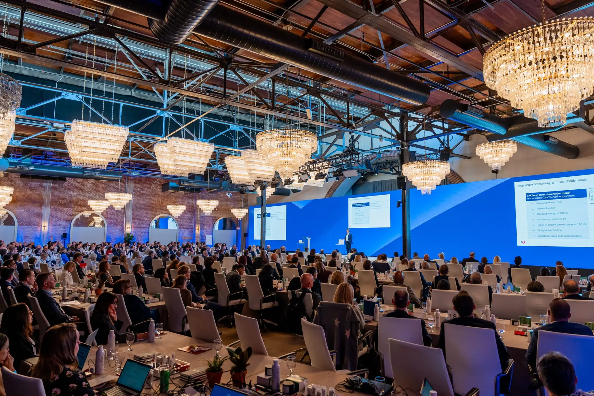 Wide shot of general session audience listening to keynote speaker at The Revelry North End