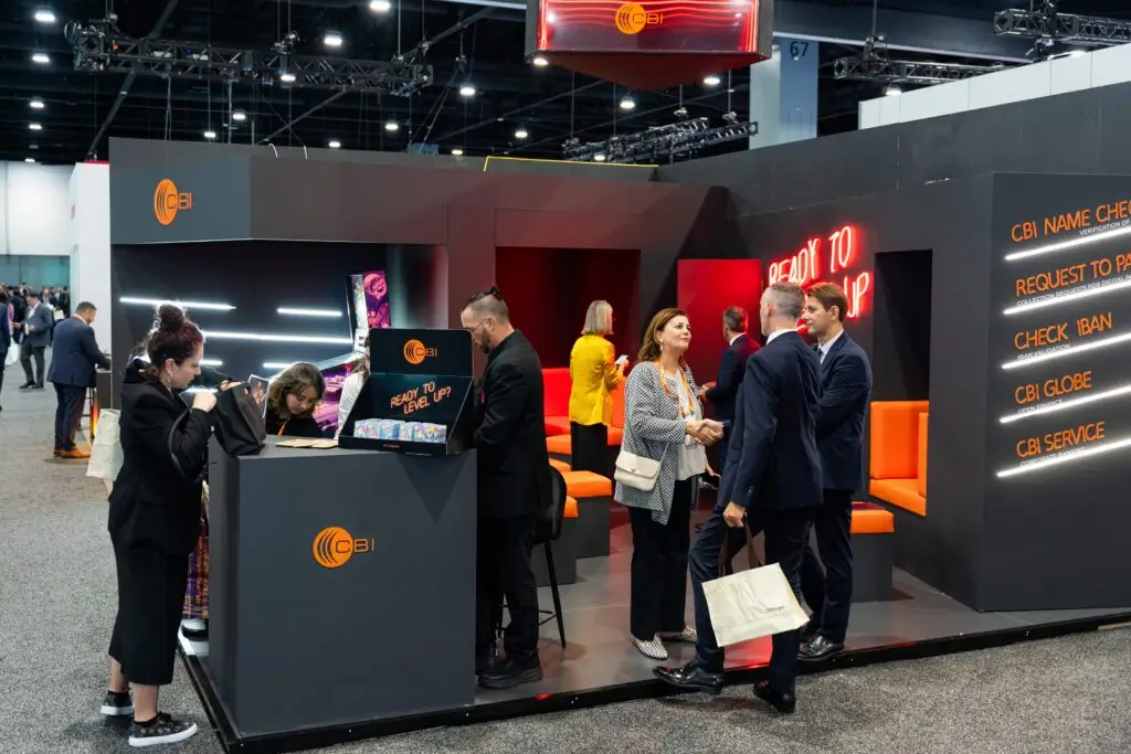 CBI team welcoming visitors at its Sibos exhibition booth